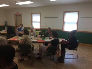 adults in classroom sitting at tables